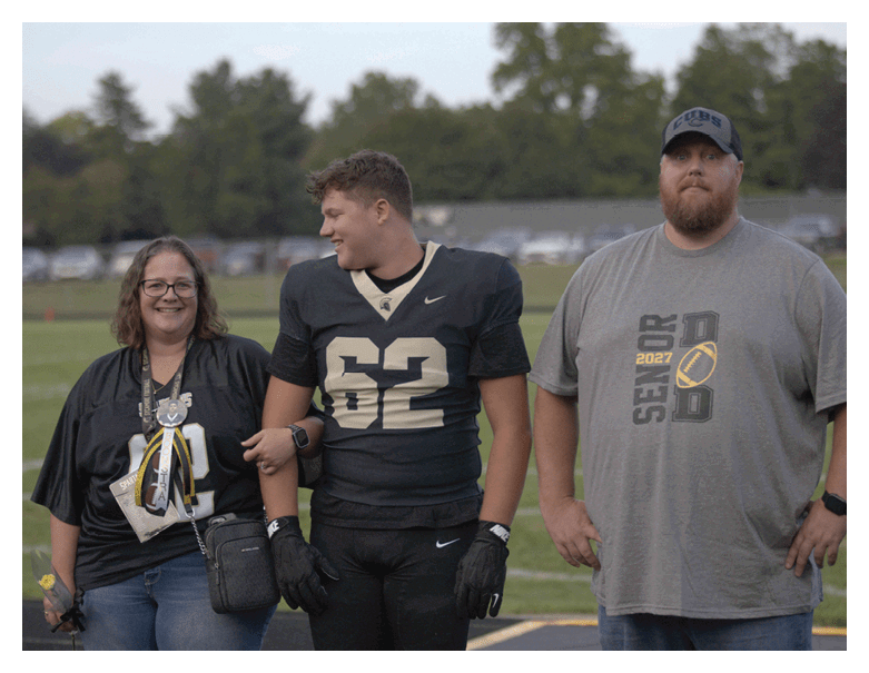 A young man wearing a football jersey with the name Vista on the back. AI generated content