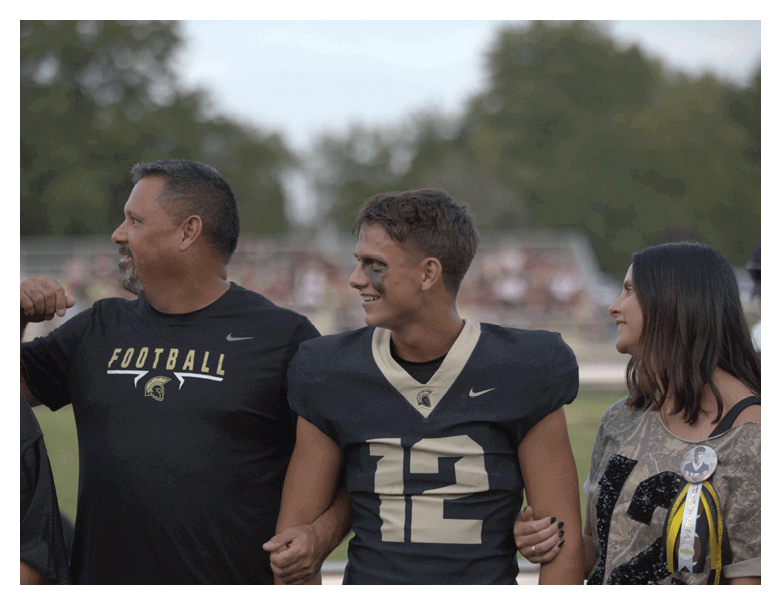 A young man wearing a football jersey with the name Vista on the back. AI generated content