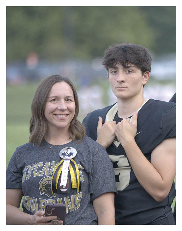 A group of football players wearing headphones and smiling. AI generated content