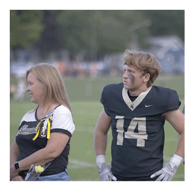 Two men wearing football helmets are talking to each other. AI generated content