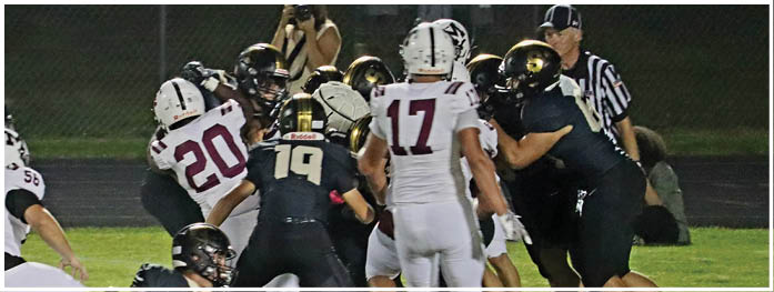 A football player is sliding on the ground. Description generated by AI