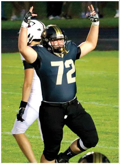 A football player wearing a blue jersey with the number 58 on it. Description generated by AI