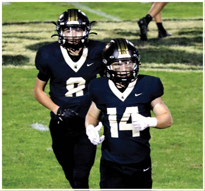 A football player wearing a blue jersey with the number 58 on it. Description generated by AI