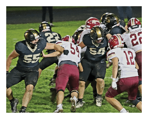 A man wearing a football uniform is jumping to catch a football. AI generated content
