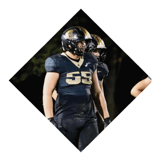A football player wearing a black jersey with the number 16 on it is holding a football. AI generated content