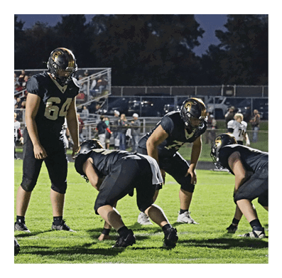 A football player in a white jersey with the number 85 on it is trying to catch a football. AI generated content