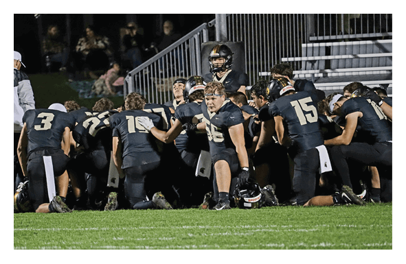 A group of people are kneeling on a field, possibly in a football game. AI generated content