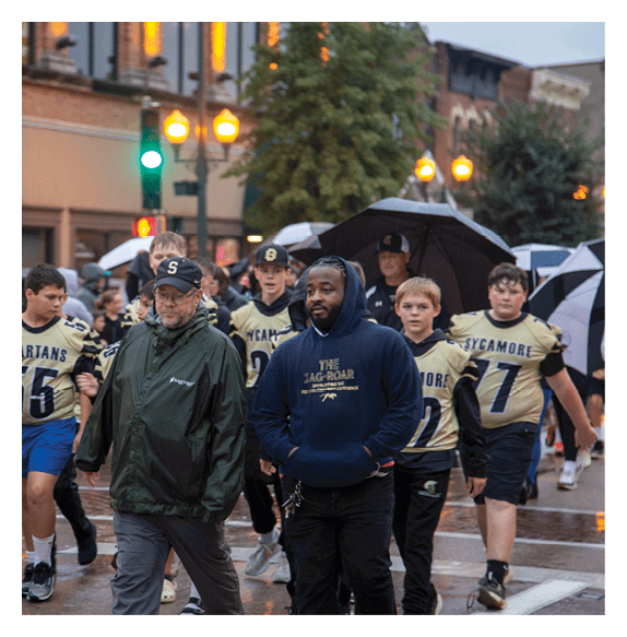 Two football players wearing Vista jerseys and holding hands. AI generated content