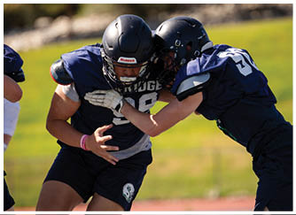 A football game is being played on a field. Description generated by AI