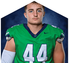 A young man wearing a white jersey with the number 10 on it. Description generated by AI