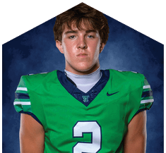 A young man wearing a white jersey with the number 10 on it. Description generated by AI