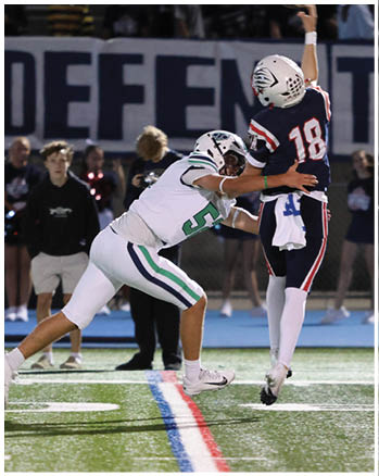 A group of football players celebrating a touchdown. Description generated by AI