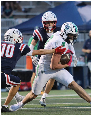 A group of football players celebrating a touchdown. Description generated by AI