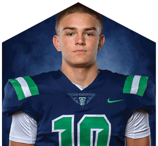 A young man wearing a white jersey with the number 10 on it. Description generated by AI
