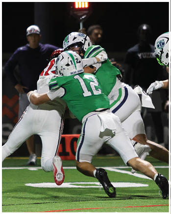 A group of football players celebrating a touchdown. Description generated by AI