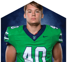 A young man wearing a white jersey with the number 10 on it. Description generated by AI