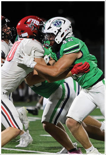 A group of football players celebrating a touchdown. Description generated by AI