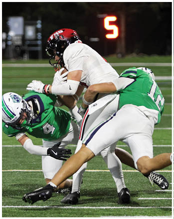 A group of football players celebrating a touchdown. Description generated by AI