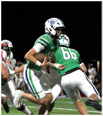 A group of football players celebrating a touchdown. Description generated by AI