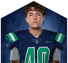 A young man wearing a white jersey with the number 10 on it. Description generated by AI