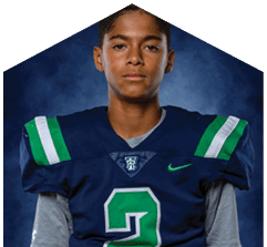 A young man wearing a white jersey with the number 10 on it. Description generated by AI