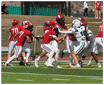 A football game is being played on a field. Description generated by AI