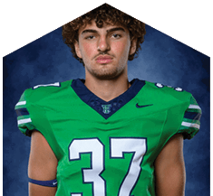A young man wearing a white jersey with the number 10 on it. Description generated by AI