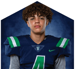 A young man wearing a white jersey with the number 10 on it. Description generated by AI