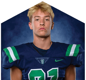 A young man wearing a white jersey with the number 10 on it. Description generated by AI