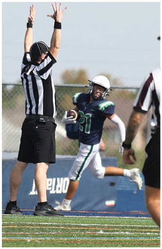 A football player catching a ball. Description generated by AI