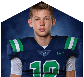 A young man wearing a white jersey with the number 10 on it. Description generated by AI