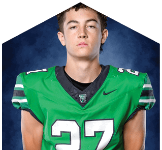 A young man wearing a white jersey with the number 10 on it. Description generated by AI