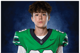 A young man wearing a white jersey with the number 10 on it. Description generated by AI