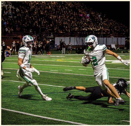 Two football players wearing black jerseys with the number 11 on them. Description generated by AI