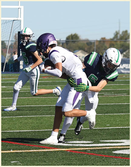 A group of football players on a field. Description generated by AI