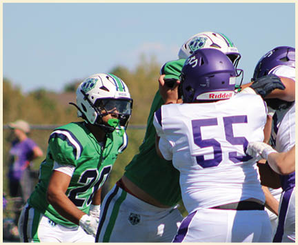 A group of football players posing for a picture. Description generated by AI