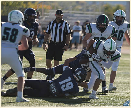 A group of football players posing for a picture. Description generated by AI