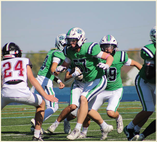 A group of football players on a field. Description generated by AI