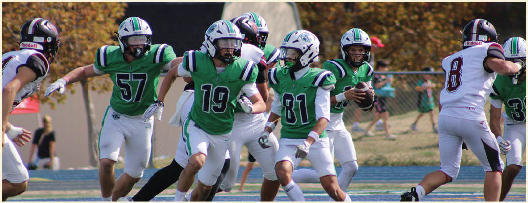 A group of football players posing for a picture. Description generated by AI