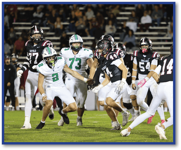 A group of football players wearing black jerseys with the number 3 on them. Description generated by AI