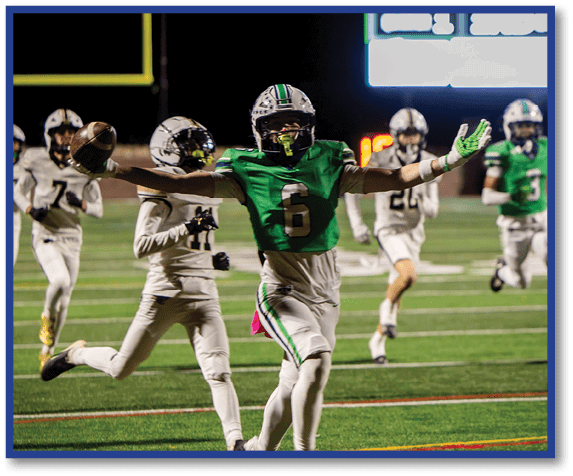 A group of football players wearing black jerseys with the number 3 on them. Description generated by AI