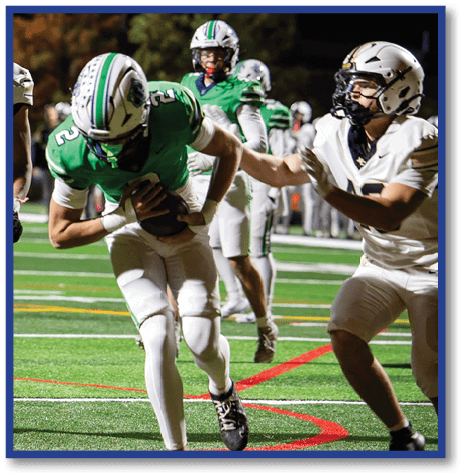 A football player wearing a black jersey with the number 6 on it. Description generated by AI