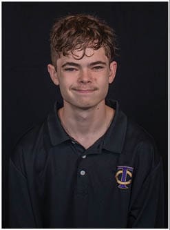 A football player running on the field. Description generated by AI