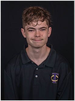 A football player running on the field. Description generated by AI