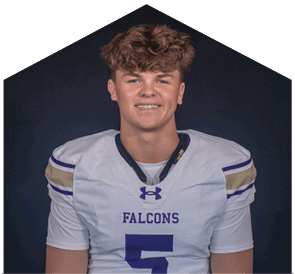 A young man wearing a white jersey with the number 0 on it. Description generated by AI