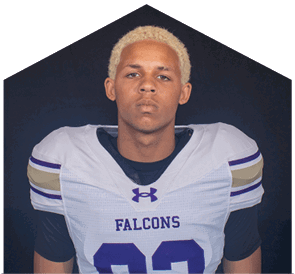 A young man wearing a white jersey with the number 0 on it. Description generated by AI