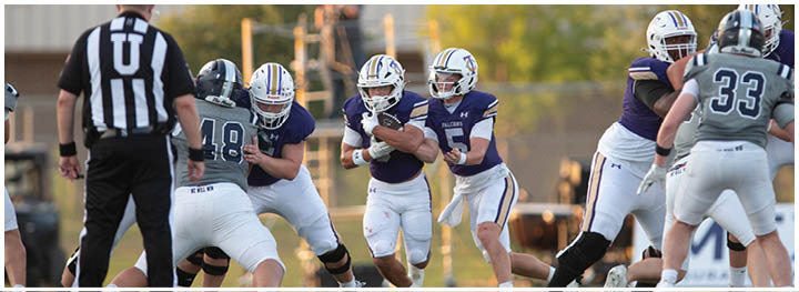 A group of football players on a field. Description generated by AI