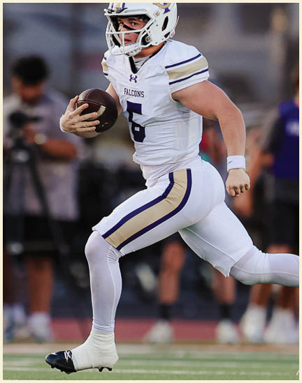 A football player wearing a black jersey with the number 11 on it. Description generated by AI