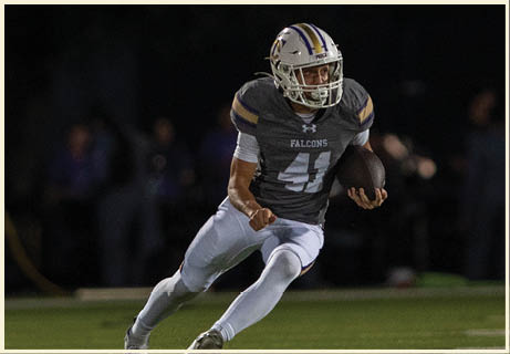 A football player wearing a black jersey with the number 11 on it. Description generated by AI