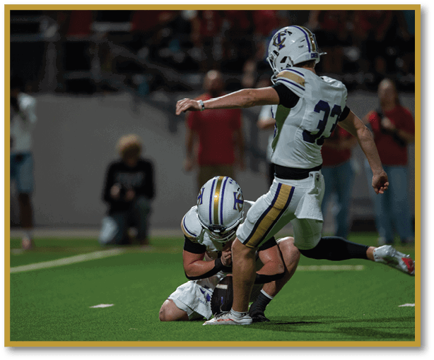 A football player is kicking a football on a field. Description generated by AI